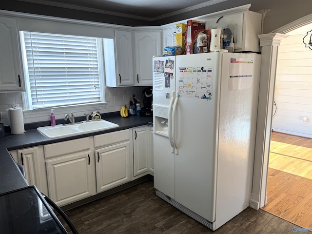 205 Pine Rd, Gadsden, AL 35901 - kitchen featuring white fridge with ice dispenser, a sink, white cabinets, backsplash, and dark countertops