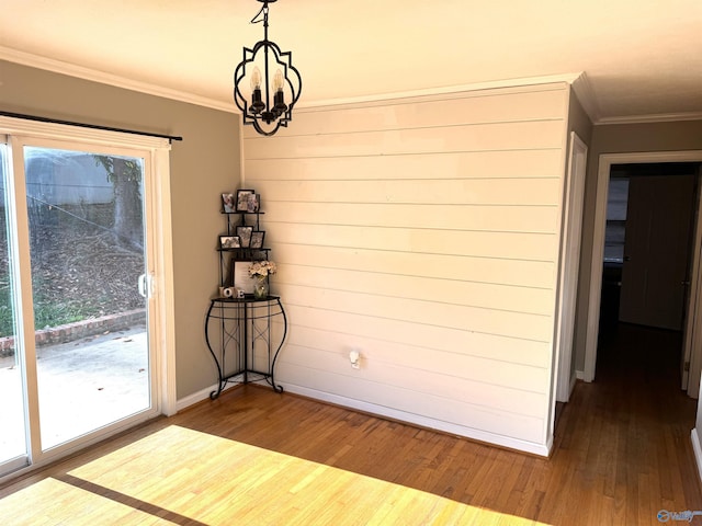 205 Pine Rd, Gadsden, AL 35901 - unfurnished dining area featuring a chandelier, ornamental molding, wood finished floors, and healthy amount of natural light
