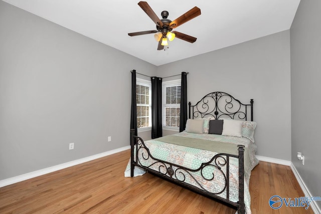 bedroom with hardwood / wood-style flooring and ceiling fan