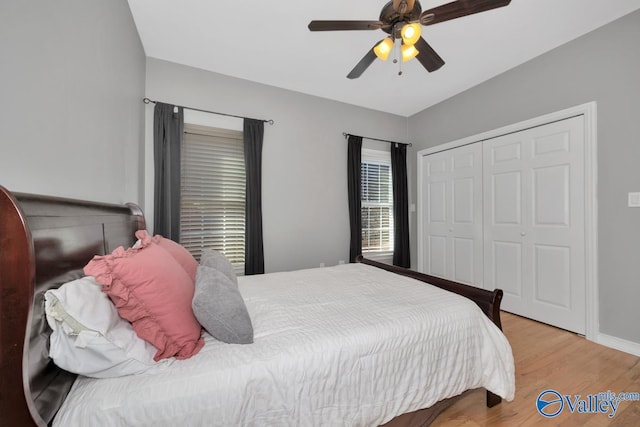 bedroom featuring a closet, ceiling fan, and light hardwood / wood-style floors