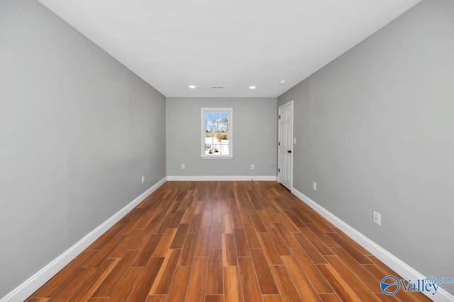 empty room featuring wood-type flooring