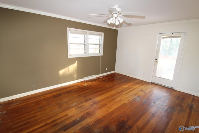 spare room with ceiling fan, ornamental molding, and dark hardwood / wood-style floors