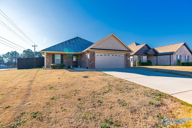 ranch-style home featuring a garage and a front yard