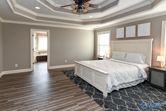 bedroom with a raised ceiling, ceiling fan, and ornamental molding