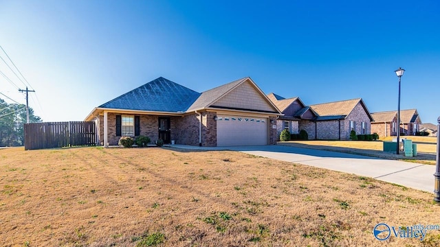 25988 Stef Ln, Athens, AL 35613 - ranch-style home with a front lawn and a garage