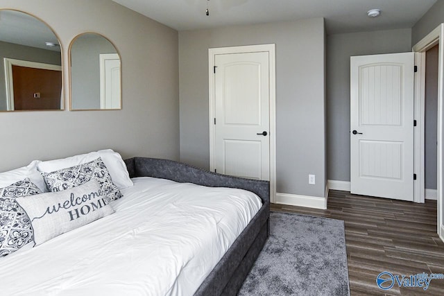 bedroom featuring dark hardwood / wood-style flooring