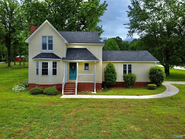 traditional-style home featuring a chimney, a front lawn, roof with shingles, and a porch