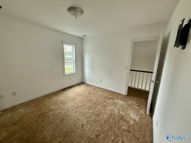 unfurnished bedroom featuring baseboards