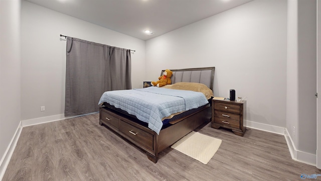 bedroom with light hardwood / wood-style flooring