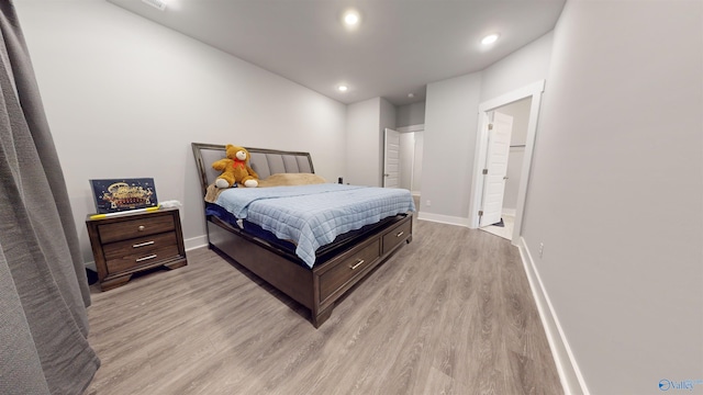 bedroom with light hardwood / wood-style flooring