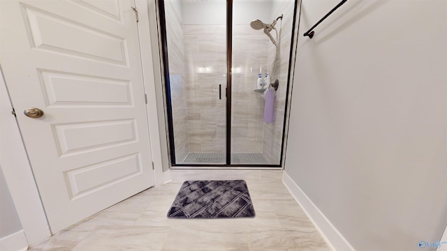 bathroom with a shower with shower door