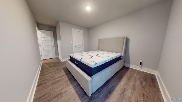 bedroom featuring dark hardwood / wood-style floors