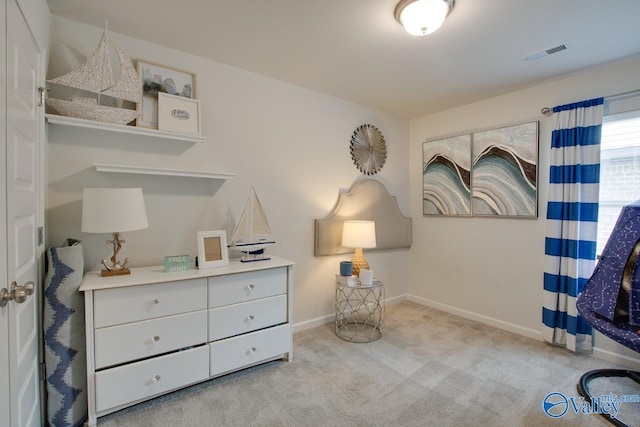 living area featuring visible vents, baseboards, and carpet floors