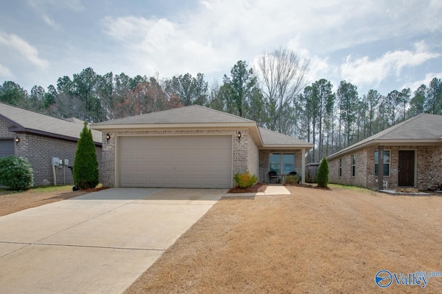 ranch-style house featuring an attached garage, brick siding, and driveway