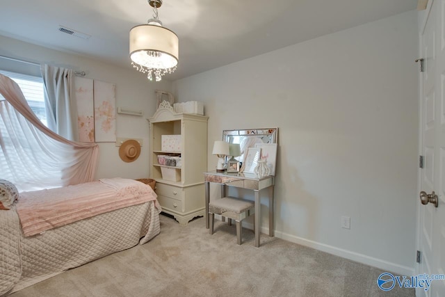 bedroom with visible vents, baseboards, carpet, and a chandelier