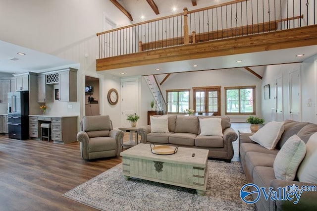 living room featuring recessed lighting, high vaulted ceiling, wood finished floors, and stairway