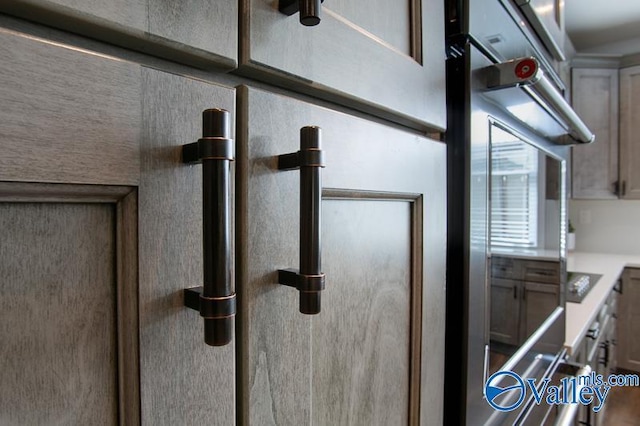 details with light countertops and stainless steel double oven