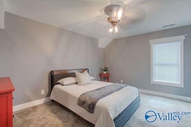 bedroom with visible vents, carpet flooring, and baseboards