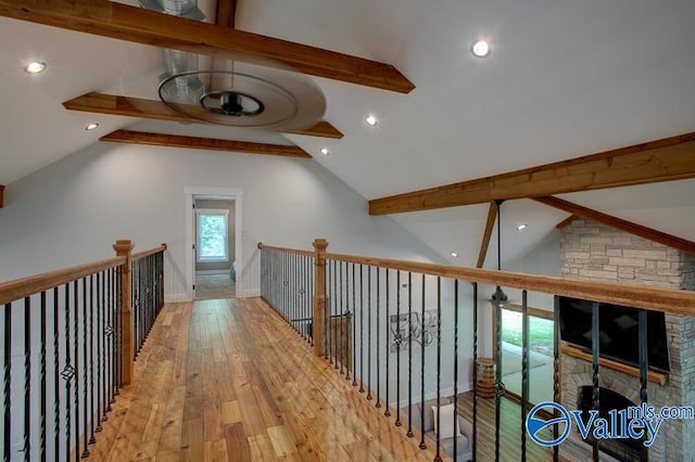hall with wood-type flooring, lofted ceiling with beams, baseboards, and recessed lighting