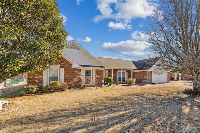 view of front facade with a garage and a front lawn