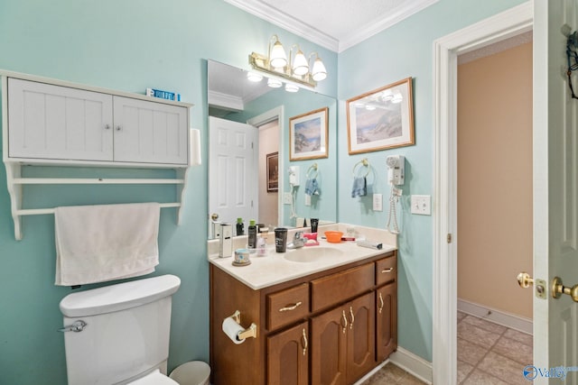 bathroom with crown molding, vanity, toilet, and tile patterned flooring