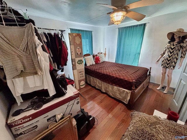 bedroom with hardwood / wood-style flooring and ceiling fan