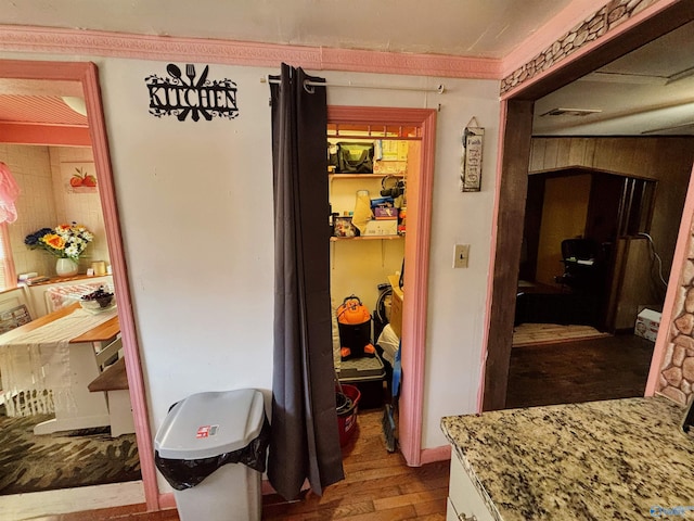 bathroom with hardwood / wood-style floors