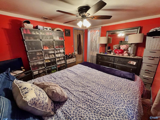 bedroom with ceiling fan and crown molding