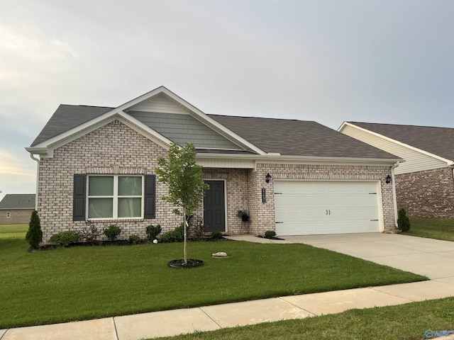 27091 Rabbit Run, Athens, AL 35613 - view of front of home featuring an attached garage, driveway, a front yard, and brick siding