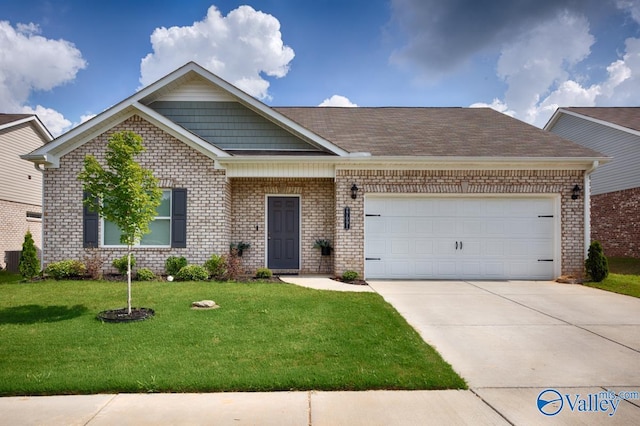 27091 Rabbit Run, Athens, AL 35613 - view of front of home featuring concrete driveway, brick siding, a garage, and a front yard
