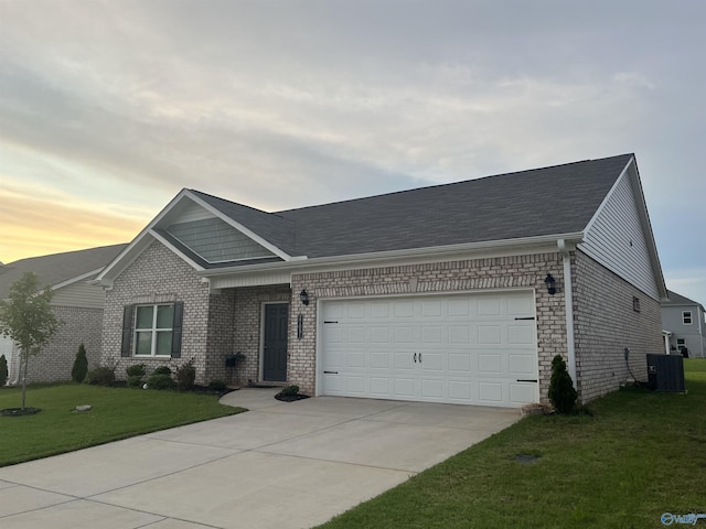 27091 Rabbit Run, Athens, AL 35613 - view of front of property with brick siding, driveway, an attached garage, and a front lawn