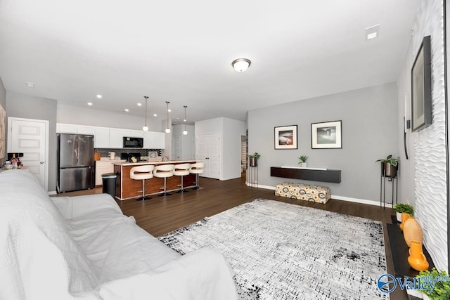 27091 Rabbit Run, Athens, AL 35613 - living area featuring dark wood-style flooring and recessed lighting
