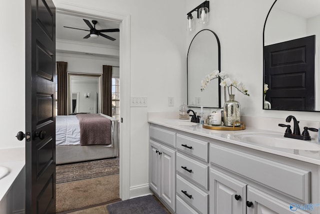 bathroom featuring a sink, double vanity, ceiling fan, and ensuite bathroom