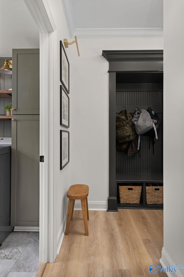 mudroom with baseboards, washer / clothes dryer, light wood-style floors, and ornamental molding