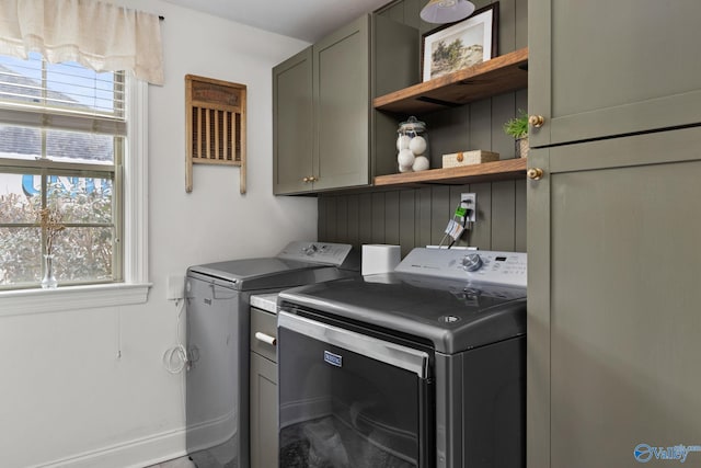 laundry room with cabinet space and independent washer and dryer