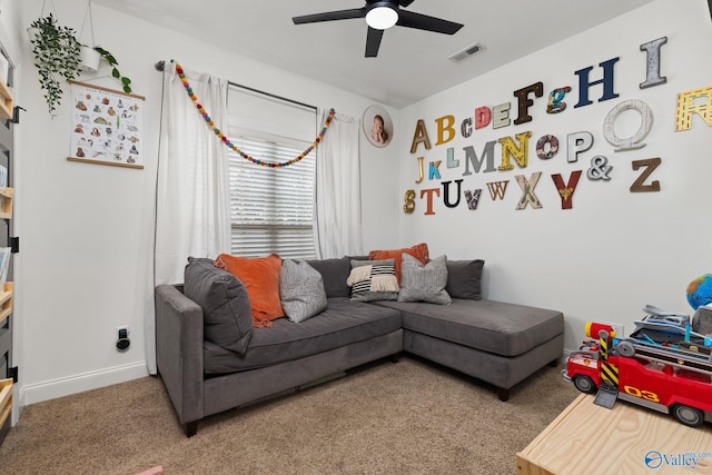 carpeted living room with visible vents, baseboards, and ceiling fan