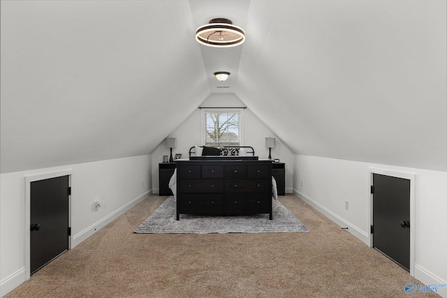 bedroom with baseboards, carpet floors, and vaulted ceiling