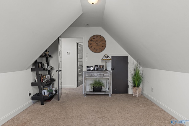 bonus room with lofted ceiling, visible vents, baseboards, and carpet floors