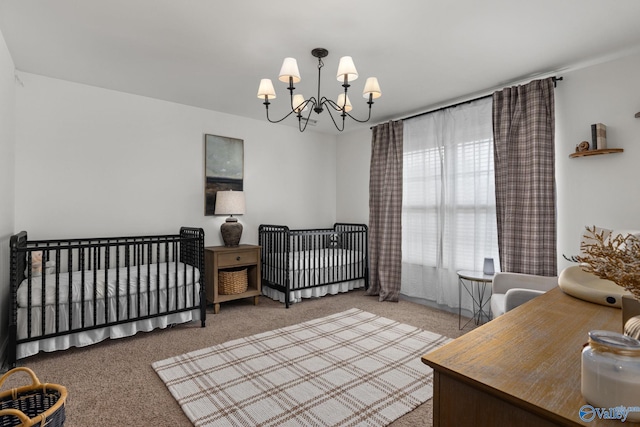 carpeted bedroom with a notable chandelier