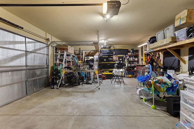 garage featuring a workshop area and a garage door opener