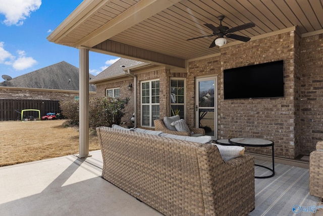 view of patio / terrace featuring a ceiling fan and fence