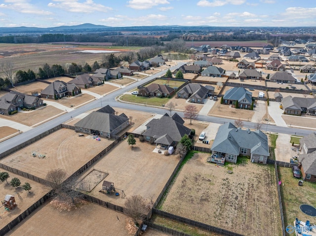 birds eye view of property with a mountain view and a residential view