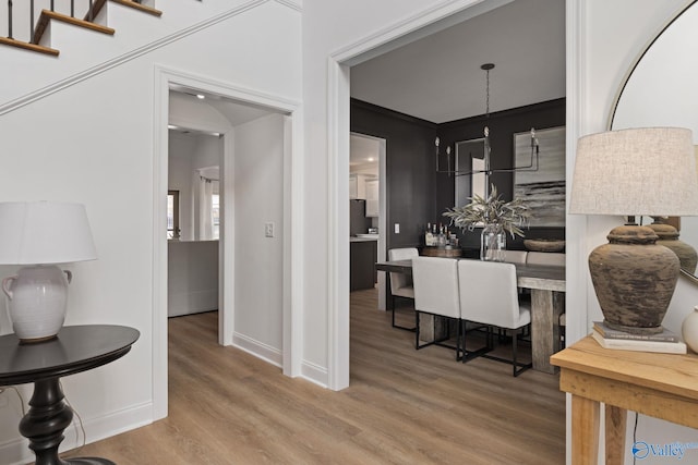 dining room featuring baseboards and wood finished floors