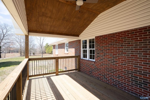 wooden terrace featuring ceiling fan