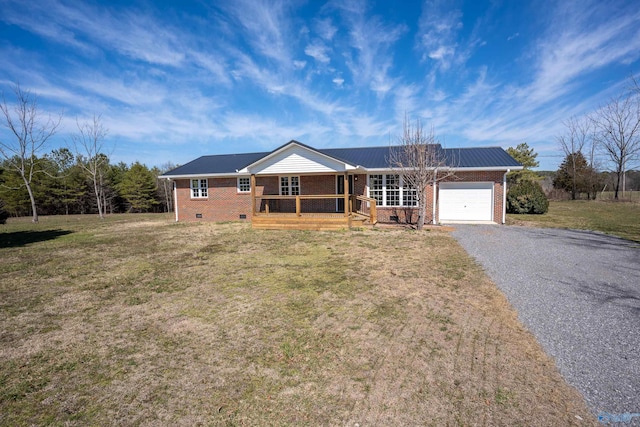 ranch-style home featuring driveway, covered porch, a front yard, a garage, and brick siding