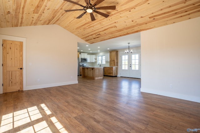 unfurnished living room with dark wood-type flooring, baseboards, lofted ceiling, ceiling fan with notable chandelier, and wooden ceiling