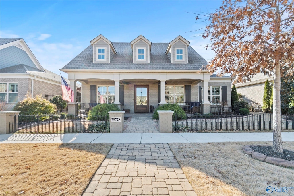 cape cod-style house with a porch