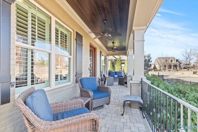 view of patio with an outdoor living space and ceiling fan