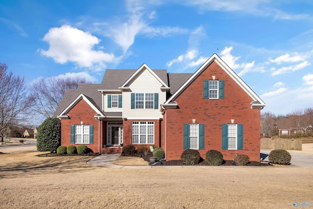 traditional-style house with brick siding