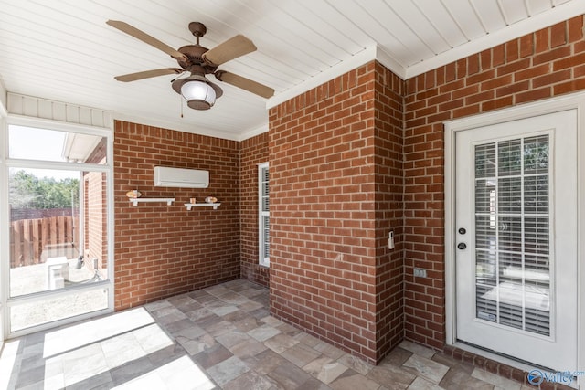 entrance to property featuring a wall mounted air conditioner, brick siding, and a ceiling fan